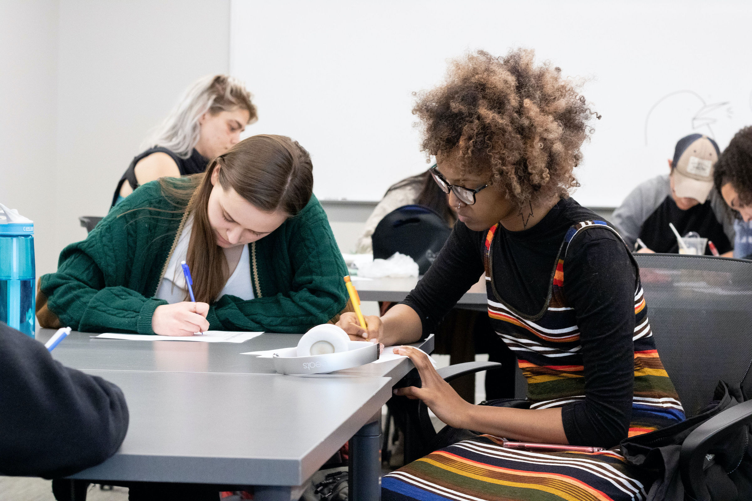 Photo of students writing in a classroom